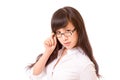 Asian woman peering over top of spectacles Royalty Free Stock Photo