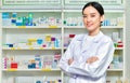 Asian woman pharmacist, chemist woman standing in pharmacy Royalty Free Stock Photo