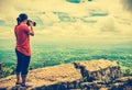 Asian woman photographed the beautiful view, outdoor on summer d Royalty Free Stock Photo