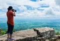 Asian woman photographed the beautiful view, outdoor on summer d Royalty Free Stock Photo