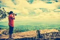 Asian woman photographed the beautiful view, outdoor on summer d Royalty Free Stock Photo