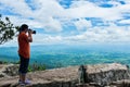 Asian woman photographed the beautiful view, outdoor on summer d Royalty Free Stock Photo