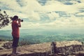 Asian woman photographed the beautiful view, outdoor on summer d Royalty Free Stock Photo