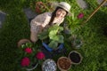 Asian woman plant a flower in her garden