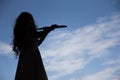 Asian Woman playing flute instrument in Silhouette shape with sk