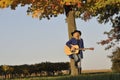 Asian Woman Playing Guitar Royalty Free Stock Photo