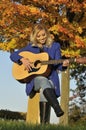 Asian Woman Playing Guitar Royalty Free Stock Photo