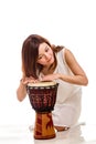 Asian woman playing hand drum Royalty Free Stock Photo