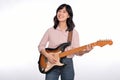 Asian woman playing a vintage sunburst electric guitar  on white background Royalty Free Stock Photo