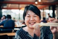 Asian woman in barbeque yakiniku grill restaurant Royalty Free Stock Photo