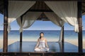 Asian woman practice yoga at luxury beach resort Royalty Free Stock Photo