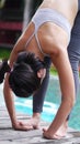 Asian woman practice Yoga Pose standing hand catch toe close up