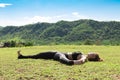 Asian woman practice yoga Supta Padangustasana B or Reclining Hand to Big Toe Pose stretching exercise muscle with yoga Royalty Free Stock Photo