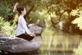 Asian woman practices yoga