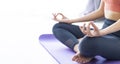 Asian woman practicing yoga indoor with easy and simple position to control breathing in and out in meditation pose