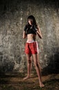 Asian Woman Practising Muay Thai Boxing