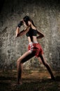 Asian Woman Practising Muay Thai Boxing Royalty Free Stock Photo