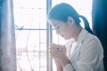 Asian woman pray at home, Church online, Praying hands, Worship at home
