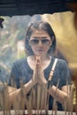 Asian woman praying at buddhist temple in thailand Royalty Free Stock Photo