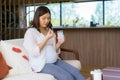 Asian woman pregnant mother holding medicine supplement drugs and glass of water - taking vitamins during pregnancy Royalty Free Stock Photo