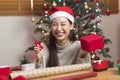 Asian Woman prepare Christmas gift box under X` mas tree in home living room. Royalty Free Stock Photo