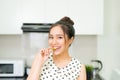 Asian woman preparing healthy meal in her home kitchen Royalty Free Stock Photo