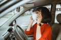 Woman in protective mask driving a car on road. Safe traveling. Royalty Free Stock Photo