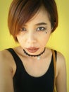 Asian woman punk makeup portrait.