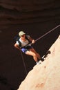 Asian woman rappels Royalty Free Stock Photo