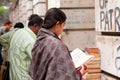 Asian woman read the book near the street book stall