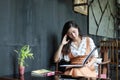 Asian women reading book and smiling and happy Relaxing in a coffee shop Royalty Free Stock Photo