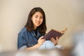 Asian woman reading a book vintage style. Royalty Free Stock Photo