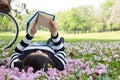 Asian woman reading booklet