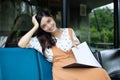 Asian women reading and smiling and happy Relaxing in a coffee s Royalty Free Stock Photo