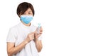 Asian woman recommends facemask and hand sanitizer for protection against virus germs Royalty Free Stock Photo