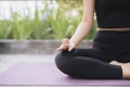 Asian woman relax in the holiday. Play if yoga. On the balcony