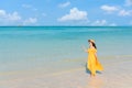 Asian woman relax smile walking around sea beach ocean with white cloud on blue sky in travel vacation. Copy space Royalty Free Stock Photo