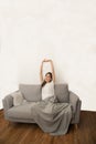 Asian woman relaxed and resting breathing fresh on sofa. Royalty Free Stock Photo