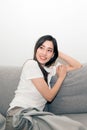 Asian woman relaxed and resting breathing fresh on sofa. Royalty Free Stock Photo