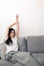 Asian woman relaxed and resting breathing fresh on sofa. Royalty Free Stock Photo