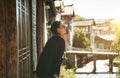 Asian woman relaxing and enjoying sunlight