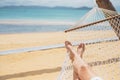 Asian women relaxing in hammock summer holiday on beach Royalty Free Stock Photo