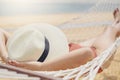 Asian women relaxing in hammock summer holiday on beach Royalty Free Stock Photo