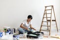 Asian woman renovating the house