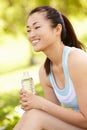 Asian woman resting after exercise Royalty Free Stock Photo