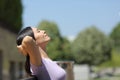 Asian woman resting sitting on a bench in a park Royalty Free Stock Photo