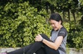 Asian woman runner suffering from pain in leg be injured,Hand touching her knee after jogging Royalty Free Stock Photo