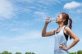 Asian woman runners are drinking water. After training Royalty Free Stock Photo