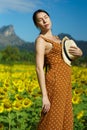 Asian Woman 40s LGBT transgender express feeling Happy Smile fun under sunshine in Sunflower yellow Royalty Free Stock Photo