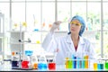 Woman scientist doing experiment. Royalty Free Stock Photo